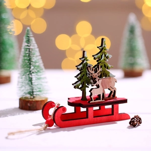 DIY colorful wooden Christmas sleigh ornament with reindeer and snowy trees on table