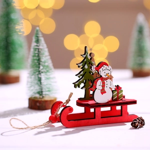 DIY colorful wooden Christmas sleigh ornament with snowman and tree in festive holiday scene