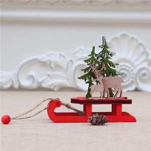 Detail of DIY wooden Christmas sleigh with reindeer and laser-cut green trees