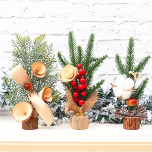 Three mini tabletop Christmas trees with pine needles, red berries and cotton on wood base