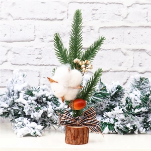 Close-up of 25cm mini Christmas tree with cotton boll, berries, and wooden base