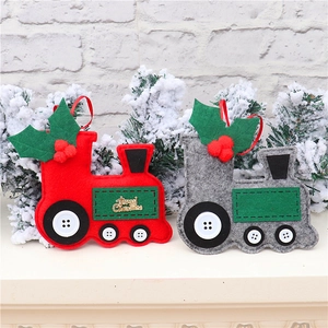 Detail of Christmas felt car pendants with Merry Christmas embroidery and red berry accents