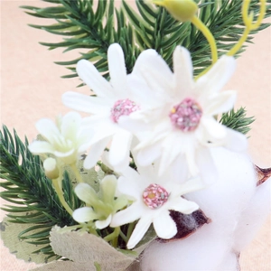 Detailed close-up of mini Christmas tree with white daisies and green pine needles