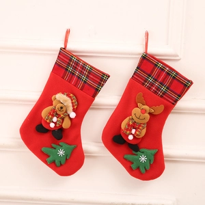 Detail of Christmas stocking gift bags featuring cartoon bear and reindeer patterns