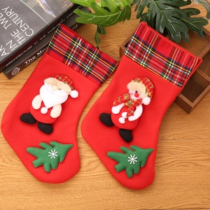 Detail of Christmas stockings with 3D Santa and snowman on a warm wooden background
