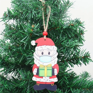 Christmas tree wooden ornament featuring Santa Claus wearing a face mask with red beads