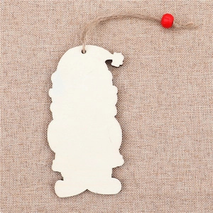 Detail of wooden Santa Claus ornament with jute rope and red bead for DIY Christmas decor