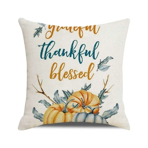 Close-up of linen pillowcase with watercolor pumpkin and grateful thankful blessed text
