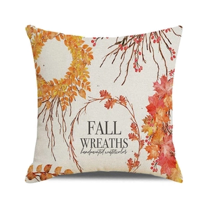 Detail of linen pillowcase with watercolor fall wreath and handpainted leaf pattern