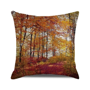 Detail of square pillowcase featuring golden forest and autumn leaves path landscape