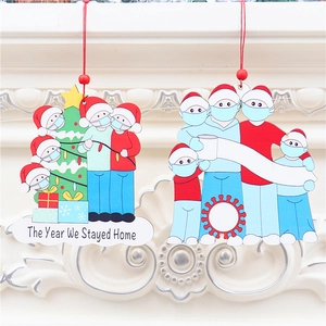 Family Christmas wooden ornaments featuring face masks and The Year We Stayed Home text