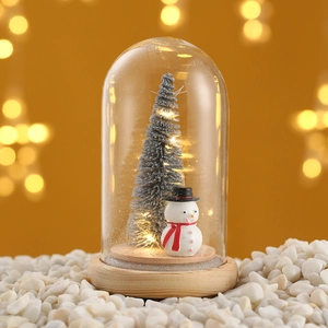 Mini Christmas tree with snowman in glass dome on wood base with warm LED lights