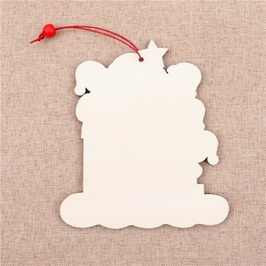 Macro view of unpainted wooden snowman pendant with red hanging cord and bead