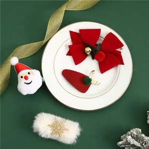 Christmas hair clips set featuring red velvet bows, antlers and Santa Claus accessories
