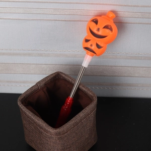 Halloween pumpkin glow stick with spring dual pumpkin heads and red handle bar