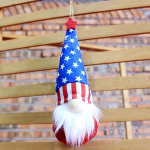 Close-up of July 4th gnome ornament with star patterns and red white stripes