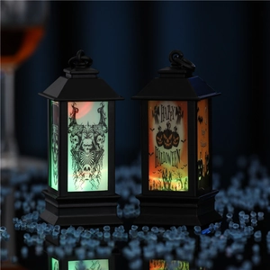 Close-up of Halloween LED lanterns with glowing skull and orange pumpkin patterns