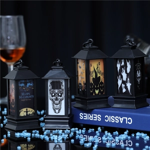Set of four Halloween lanterns with skull and pumpkin patterns for spooky party decor