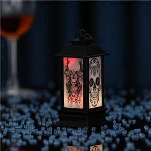 Gothic Halloween lantern featuring skull motif with eerie red glow on a blue reflective base