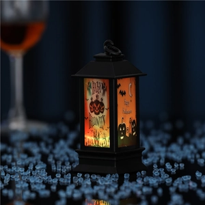 Detail of Halloween lantern with LED warm light featuring pumpkin and ghost illustrations