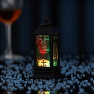 Detail of LED Halloween lantern with glowing pumpkin print and hanging ring handle