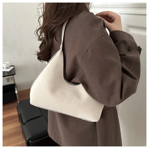Close-up of cream-white leather Hobo bag with JHASHIQING embossed logo detail