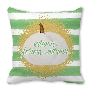 Detail view of white pumpkin with autumn text on striped peach skin pillow cover