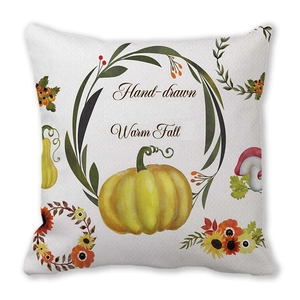 Detail of watercolor pumpkin and autumn leaf patterns on soft peach skin pillowcase