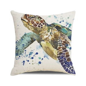 Detail of watercolor sea turtle print on a textured beige linen blend cushion cover