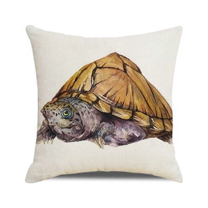 Close-up of watercolor turtle print on natural linen square cushion cover fabric texture