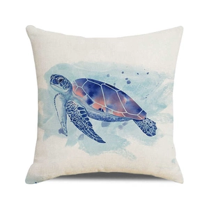 Detailed macro view showing the coarse linen texture and watercolor turtle on cushion cover