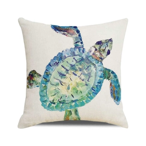 Detail of the watercolor sea turtle print on textured beige linen throw pillow cover