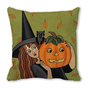 Close-up of Halloween pillow cover featuring hand-drawn witch, black cat and pumpkin art