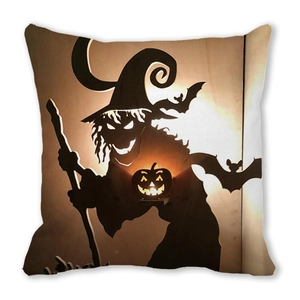 Halloween pillow cover with black witch silhouette and glowing pumpkin on white backdrop