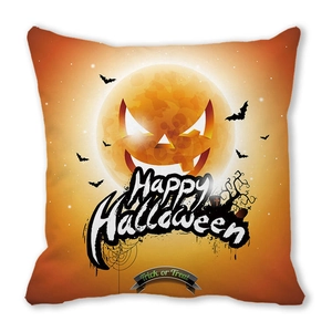 Detail of Happy Halloween pillow case with pumpkin face, moon, and bats on peach skin fabric