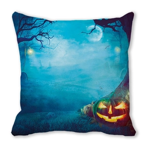 Detail of Halloween pillow case with glowing pumpkin, full moon, and misty graveyard scene