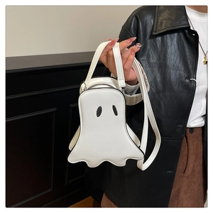 Detail of cute white ghost crossbody bag with black eye embroidery and zipper