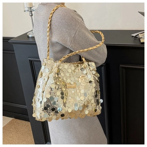 Detail of gold sequin tote bag with woven strap and embossed Fashion & Bags leather patch