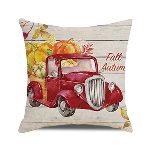 Close-up of fall watercolor pumpkin truck print on high-quality linen cushion cover