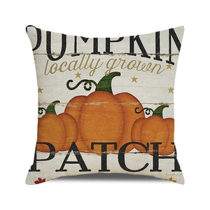 Macro detail of rustic linen texture and printed pumpkin patch design on cushion cover