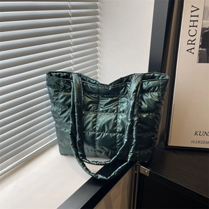 Quilted down puffer tote bag in dark green nylon with metallic satin finish and wide straps