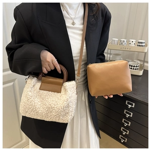 Detail showing white faux fur tote bag with brown round handles and inner storage pouch