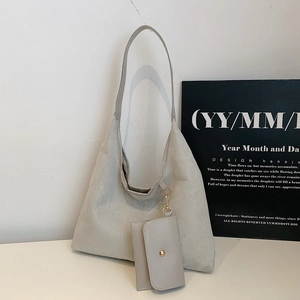 Minimalist light grey suede tote bag with matching card pouch and gold metal buckle