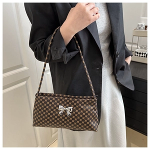 Chic leopard print shoulder bag with silver butterfly detail and geometric pattern
