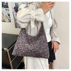 Macro view of leopard print texture and high-quality brown piping on the tote bag