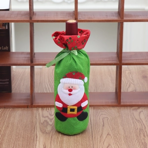 Detail of Christmas wine bottle cover with Santa Claus sequin embroidery and ribbon