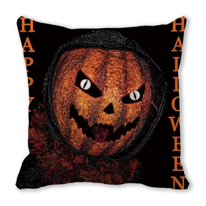 Close-up of Halloween cushion cover with orange pumpkin and red maple leaf details