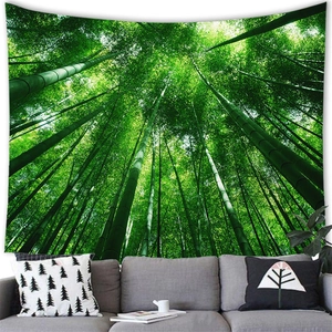 Cozy home decor featuring a bamboo forest wall tapestry above a grey fabric sofa