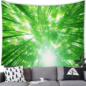Close-up of green bamboo forest tapestry with sunlight on a light grey living room wall