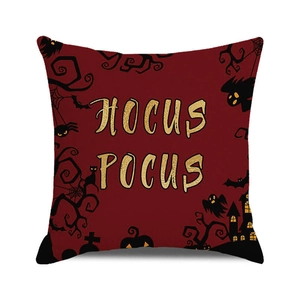 Detail showing Hocus Pocus lettering and spooky castle print on burgundy pillow case